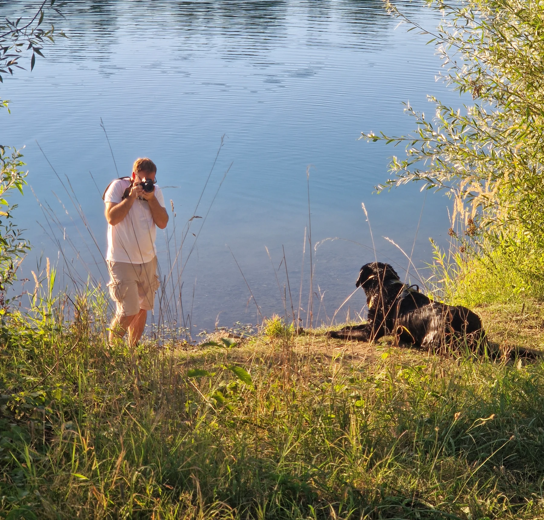 Tim photographing an animal by the water